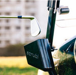Scrubi golf club cleaner attached to a golf cart, featuring durable bristles for effective club cleaning on the course