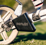 Scrubi golf club cleaner attached to a 3-wheel Clicgear, featuring durable bristles for effective club cleaning on the course.