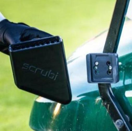 Scrubi golf club cleaner attached to a golf cart, featuring durable bristles for effective club cleaning on the course